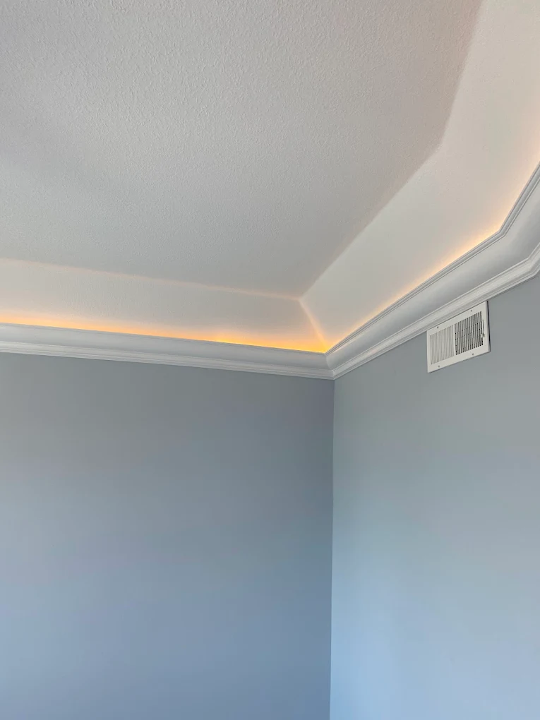 Tray ceiling with LED cove lighting and decorative crown molding