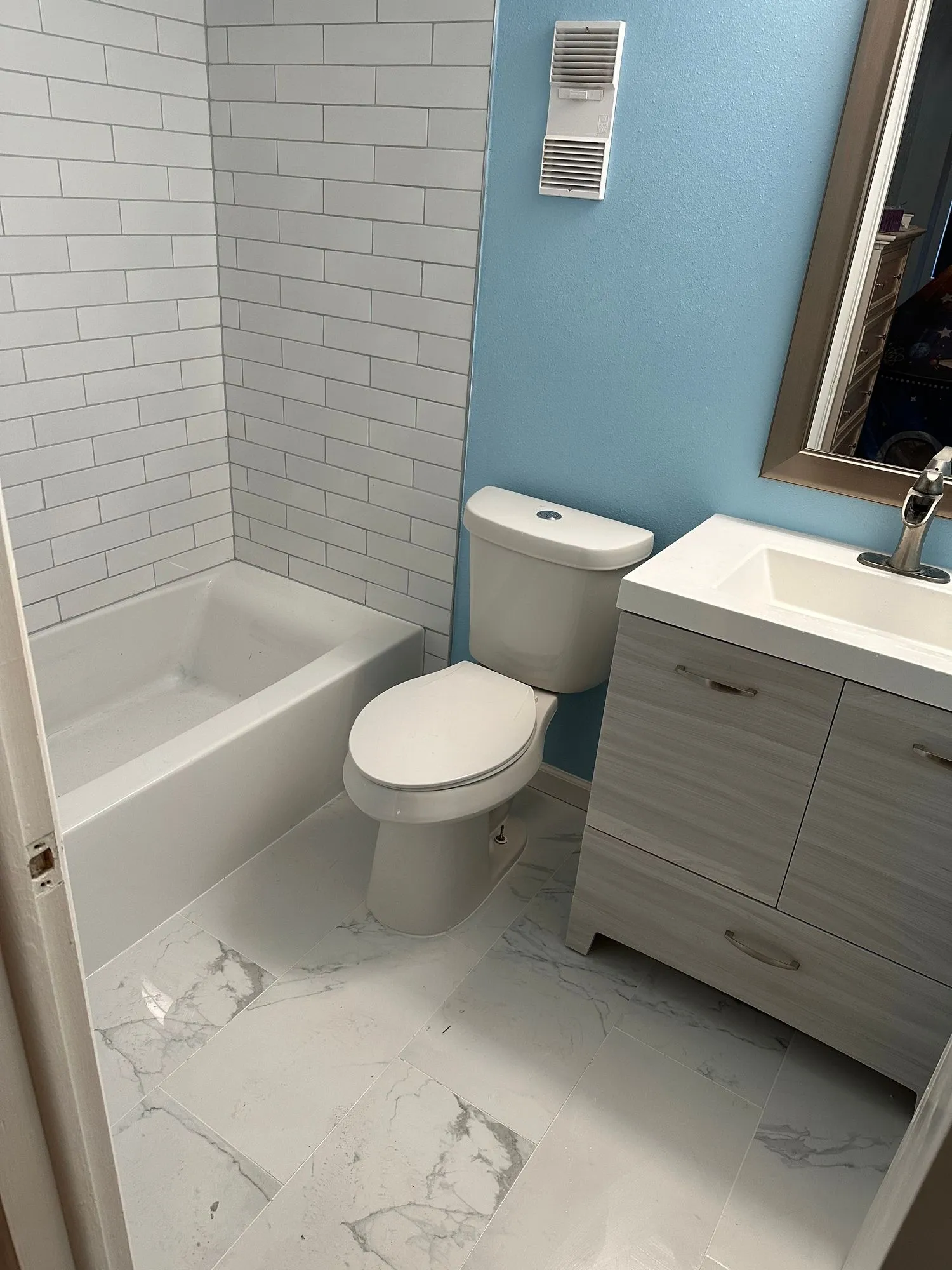 Classic bathroom remodel with subway tile and vintage vanity
