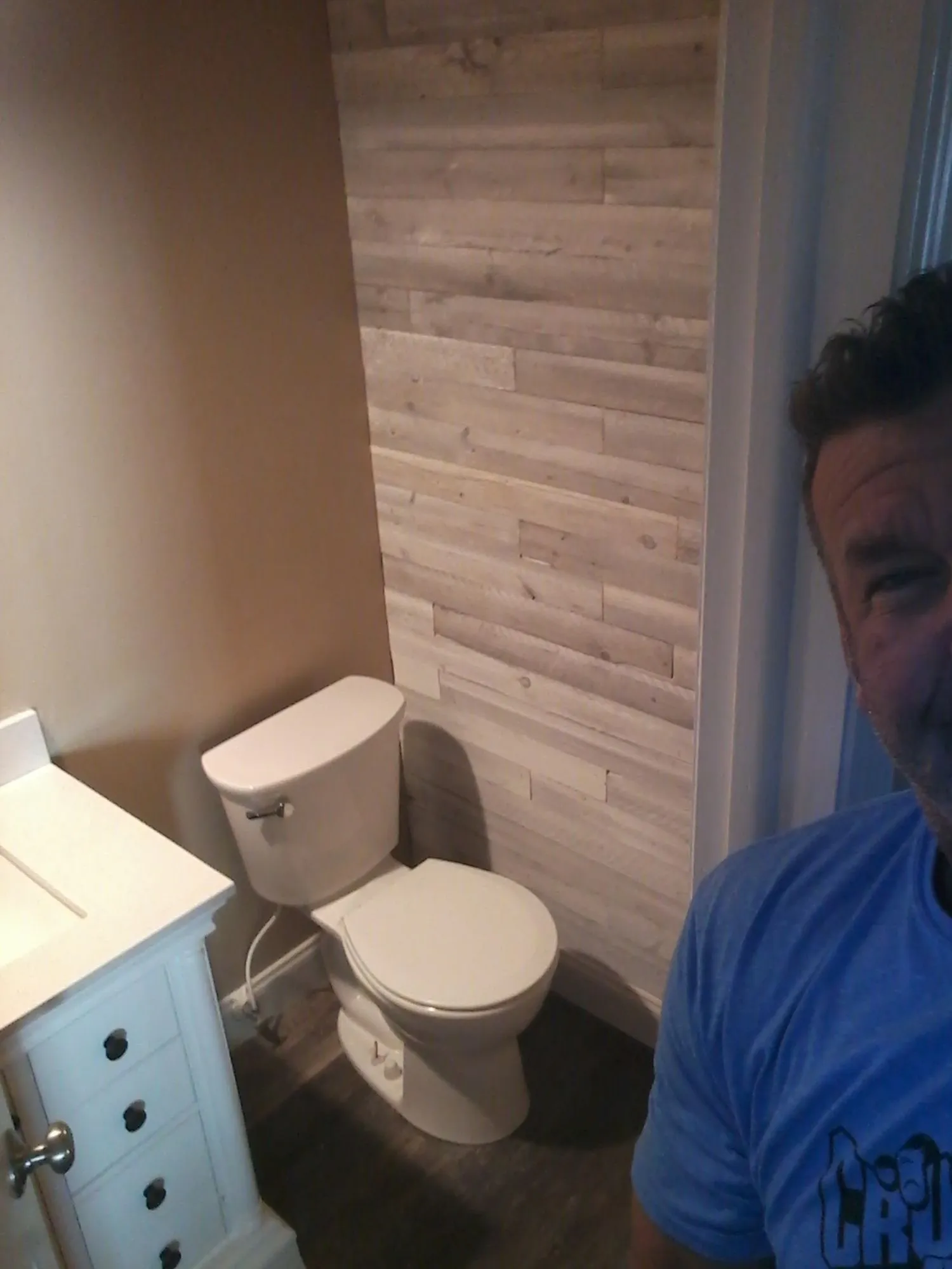 Coastal bathroom with shiplap walls and double vanity