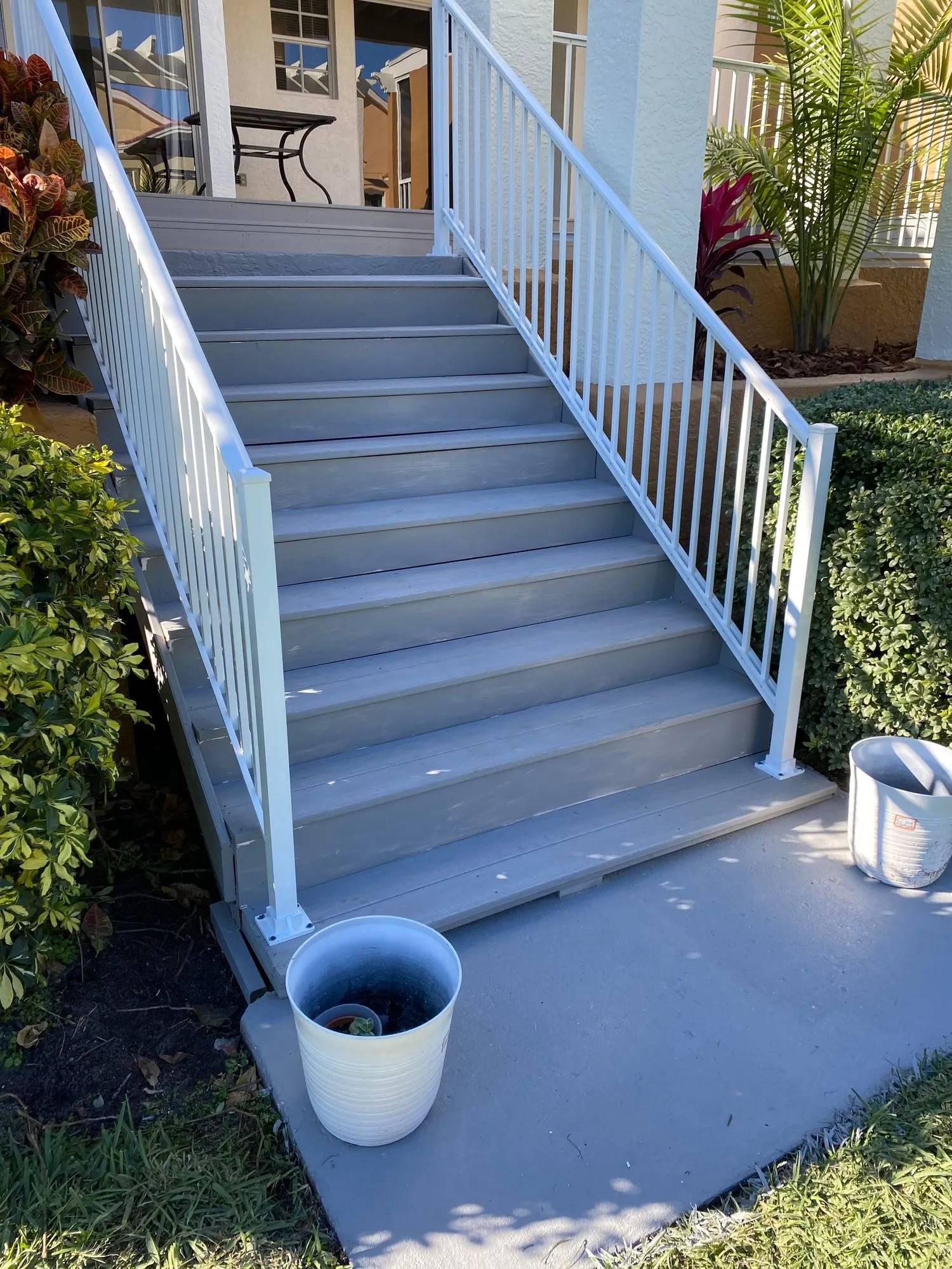 Custom staircase remodel with stained treads and white risers